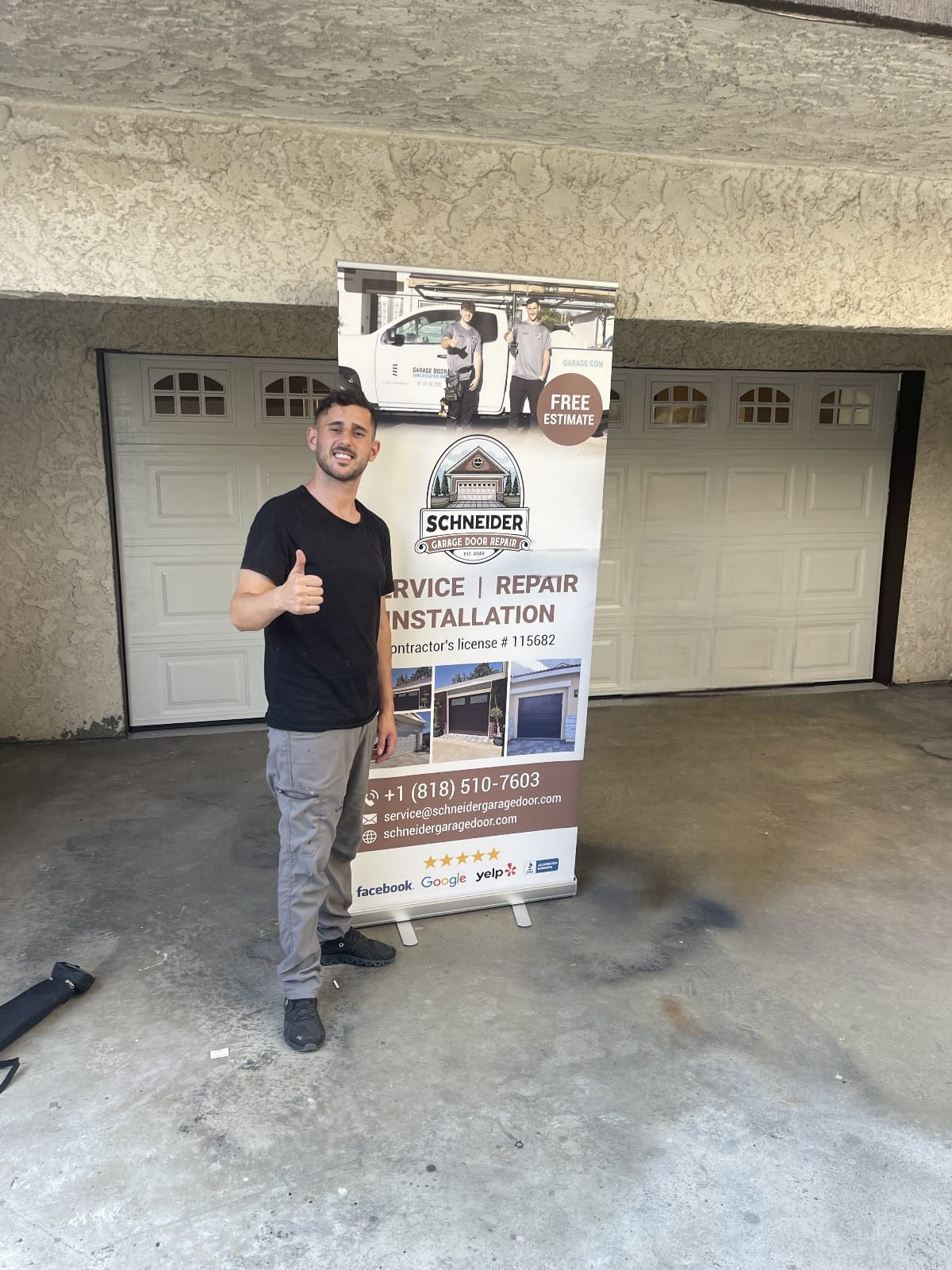 Schneider team installing a modern custom garage door